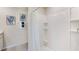 Bright bathroom with a shower and tub combination, and ample storage at 8482 Las Palmas Way, Wildwood, FL 34785