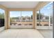 View from the covered and screened lanai showing meticulously landscaped yard and neighboring properties at 8669 Sw 88Th Loop, Ocala, FL 34481