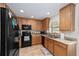 Functional kitchen featuring modern appliances, ample cabinet space and tile floor at 8677 Sw 95Th Ln # E, Ocala, FL 34481