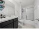 Bathroom with shower/tub combo, tile floor and dark vanity at 8920 Sw 49Th Cir, Ocala, FL 34476