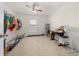 A bedroom features a ceiling fan, carpet flooring, and natural light from the window at 8920 Sw 49Th Cir, Ocala, FL 34476