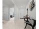 The foyer features tile flooring, a console table and view to a bedroom at 8920 Sw 49Th Cir, Ocala, FL 34476