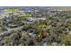 Aerial view of property at 903 NE 2nd St amid lush trees and nearby amenities at 903 Ne 2Nd St, Ocala, FL 34470