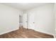 Bedroom with wood-look floors and two entryways at 903 Ne 2Nd St, Ocala, FL 34470