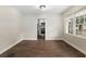 Dining room features wood floors, natural light and an adjacent kitchen with stainless appliances at 903 Ne 2Nd St, Ocala, FL 34470