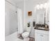 Clean bathroom featuring a shower-tub combo, granite vanity, and white cabinets at 9238 Sw 60Th Terrace Rd, Ocala, FL 34476