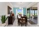 Dining area featuring modern furniture, a stylish buffet and access to the lanai at 9238 Sw 60Th Terrace Rd, Ocala, FL 34476