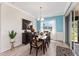 Dining area featuring modern furniture, a stylish buffet and large sliding doors for indoor/outdoor living at 9238 Sw 60Th Terrace Rd, Ocala, FL 34476