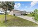 Charming single-Gathering home featuring a well-manicured lawn, a two-car garage, and beautiful landscaping at 9238 Sw 60Th Terrace Rd, Ocala, FL 34476