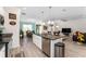 Kitchen with stainless steel appliances, modern countertops and an island that opens to the living area at 9238 Sw 60Th Terrace Rd, Ocala, FL 34476