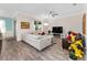 Comfortable living room with neutral tones, ceiling fan, and sliding glass doors at 9238 Sw 60Th Terrace Rd, Ocala, FL 34476