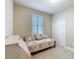 Comfortable bedroom with a daybed, closet, and shuttered window providing natural light at 9480 Sw 76Th St, Ocala, FL 34481