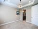 Bedroom with trey ceiling, chandelier, and an ensuite bathroom at 9480 Sw 76Th St, Ocala, FL 34481