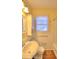 Bright bathroom with a window and a white vanity at 1022 Ne 11Th Ave, Ocala, FL 34470