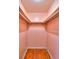 Walk-in closet with shelving and hardwood floors at 1022 Ne 11Th Ave, Ocala, FL 34470