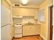 Bright kitchen features white appliances, light cabinets, and hardwood flooring at 1022 Ne 11Th Ave, Ocala, FL 34470