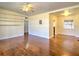 Spacious living room featuring hardwood floors, built-in shelving, and abundant natural light at 1022 Ne 11Th Ave, Ocala, FL 34470