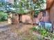 Backyard area with mature trees and a patio perfect for outdoor living at 1034 Ne 11Th St, Ocala, FL 34470