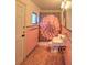 Traditional bathroom featuring pink tiles, a floral shower curtain, and standard fixtures at 1034 Ne 11Th St, Ocala, FL 34470