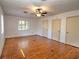 Spacious bedroom with hardwood floors and natural light, offering a blank canvas for personalization at 1034 Ne 11Th St, Ocala, FL 34470