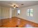 Large bedroom with hardwood floors and natural light, offering a peaceful retreat at 1034 Ne 11Th St, Ocala, FL 34470
