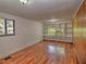Bedroom with a view, featuring wood-look flooring and built-in shelving at 1034 Ne 11Th St, Ocala, FL 34470