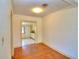 Dining room with hardwood floors leading into the kitchen area at 1034 Ne 11Th St, Ocala, FL 34470