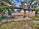 Charming single-story home with a neutral paint scheme and well-maintained landscaping at 1034 Ne 11Th St, Ocala, FL 34470