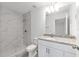 Bathroom featuring marble tile shower, granite countertop on vanity, and modern fixtures at 107 Sw Alvarez Rd, Dunnellon, FL 34431