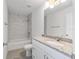Bathroom with marble tiled shower, modern vanity, and sleek fixtures at 107 Sw Alvarez Rd, Dunnellon, FL 34431
