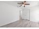 Bright bedroom with ceiling fan, spacious closet, and modern flooring at 107 Sw Alvarez Rd, Dunnellon, FL 34431