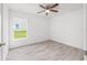 Bedroom featuring natural light, ceiling fan, and new flooring at 107 Sw Alvarez Rd, Dunnellon, FL 34431