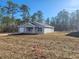 Charming single-story home featuring a classic design with a well-maintained front yard at 107 Sw Alvarez Rd, Dunnellon, FL 34431