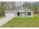 Charming single-story home featuring a one-car garage and a well-maintained lawn at 107 Sw Alvarez Rd, Dunnellon, FL 34431