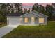 Attractive single-story home with a well-manicured lawn and a cozy front porch at 107 Sw Alvarez Rd, Dunnellon, FL 34431