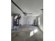 Spacious garage with a water heater, utility sink and an HVAC unit at 107 Sw Alvarez Rd, Dunnellon, FL 34431