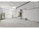 Spacious garage featuring white walls and ceiling, with door leading to house at 107 Sw Alvarez Rd, Dunnellon, FL 34431