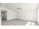 Living room with neutral walls, wood-look flooring, and ceiling fan at 107 Sw Alvarez Rd, Dunnellon, FL 34431