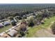 Aerial view of a community with golf course, showcasing homes and recreational space at 11587 Sw 72Nd Cir, Ocala, FL 34476