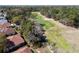 View of homes neighboring a golf course, with sand traps and manicured greens at 11587 Sw 72Nd Cir, Ocala, FL 34476