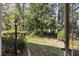 Picturesque backyard view through glass doors, showcasing lush greenery and an inviting outdoor space at 11587 Sw 72Nd Cir, Ocala, FL 34476