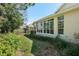 Large windows offer backyard views from this bright, beautiful Florida home at 11587 Sw 72Nd Cir, Ocala, FL 34476