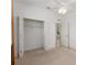 This spacious bedroom has a ceiling fan, closet, and a large window at 11587 Sw 72Nd Cir, Ocala, FL 34476