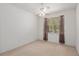 Neutral bedroom with a ceiling fan, curtains, and natural light at 11587 Sw 72Nd Cir, Ocala, FL 34476
