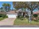 Charming single-story home featuring a well-manicured lawn and attached two-car garage at 11587 Sw 72Nd Cir, Ocala, FL 34476