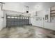 Spacious garage with overhead door, offering ample parking and storage space at 11587 Sw 72Nd Cir, Ocala, FL 34476