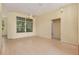 Spacious living room with wood floors, large windows and light yellow walls at 11587 Sw 72Nd Cir, Ocala, FL 34476