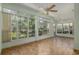 Light-filled sunroom boasts floor-to-ceiling windows at 11587 Sw 72Nd Cir, Ocala, FL 34476