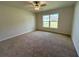 Cozy bedroom with carpeted floors and a large window, providing ample natural light at 13042 Sw 60Th Court Rd, Ocala, FL 34473