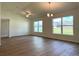 Spacious living room with ample natural light and wood-look floors throughout at 13042 Sw 60Th Court Rd, Ocala, FL 34473
